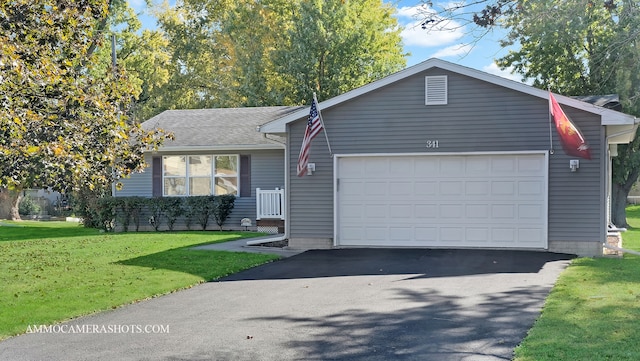 ranch-style house with a front yard and a garage