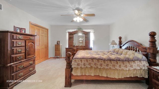 carpeted bedroom with a closet and ceiling fan