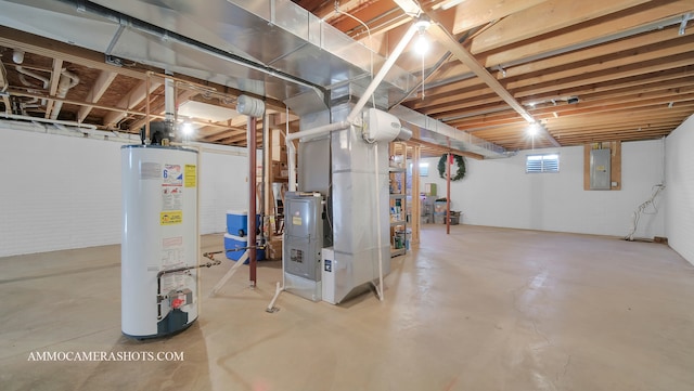 basement featuring heating unit, electric panel, and water heater