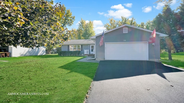 view of front of house with a front lawn and a garage