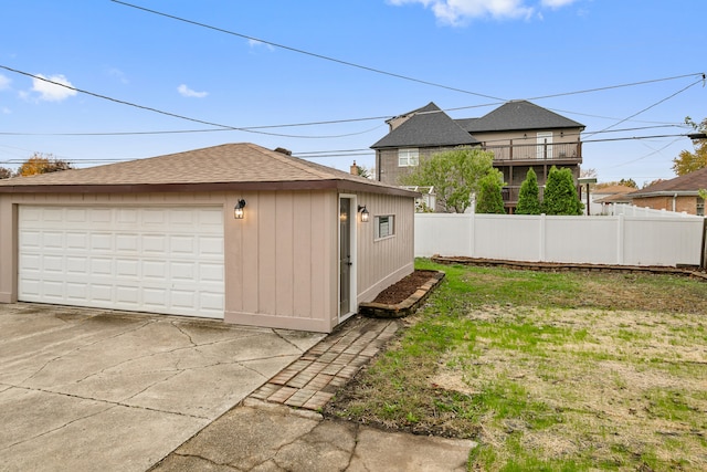 view of yard with a garage and an outdoor structure