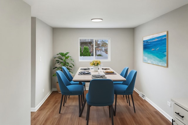 dining room featuring light hardwood / wood-style floors