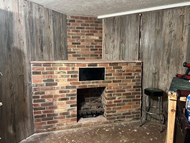 details with a textured ceiling and wooden walls