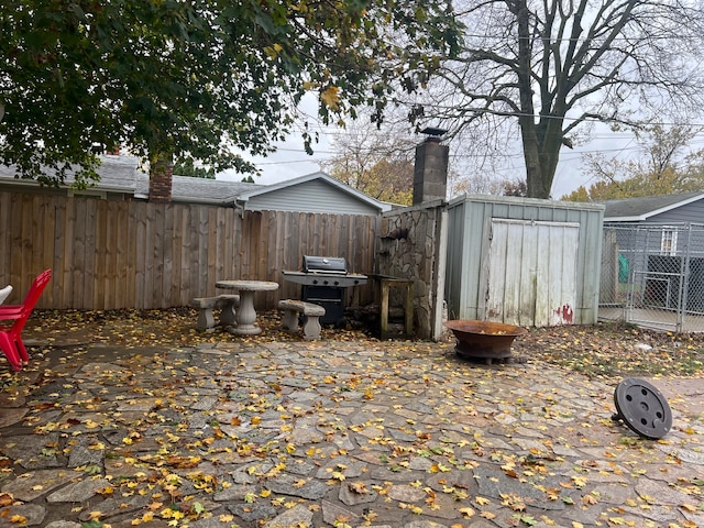 view of patio / terrace featuring a storage unit