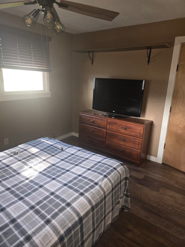 unfurnished bedroom featuring wood-type flooring, a textured ceiling, and ceiling fan