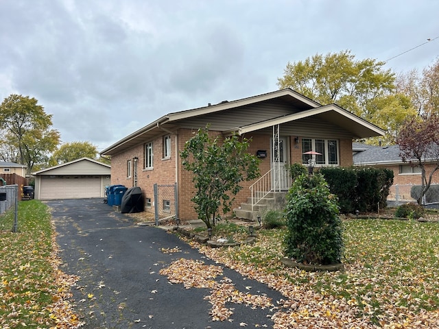 view of front of house with an outdoor structure and a garage