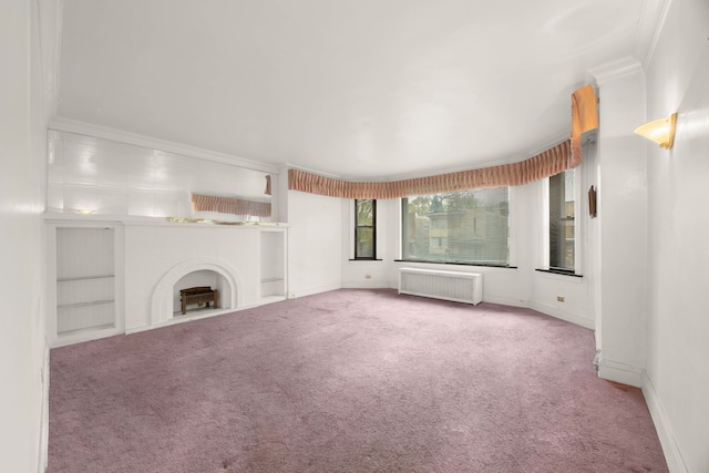 unfurnished living room featuring built in shelves, radiator, light carpet, and ornamental molding