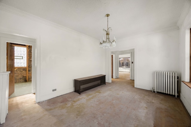 empty room with radiator, a textured ceiling, an inviting chandelier, and crown molding