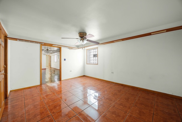 unfurnished room featuring tile patterned flooring and ceiling fan