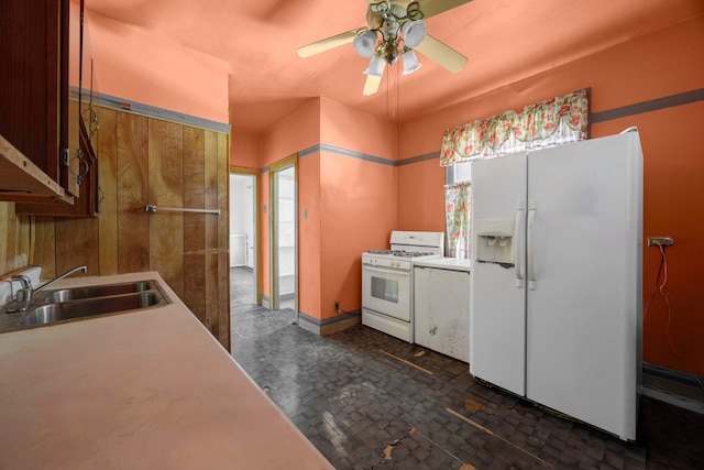 kitchen with a wealth of natural light, white appliances, sink, and ceiling fan