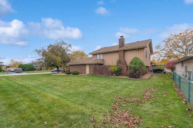 view of home's exterior featuring a yard