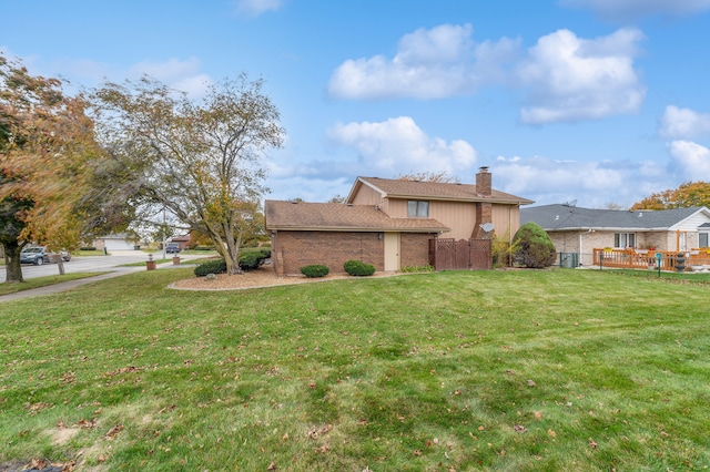 view of property exterior featuring a garage, a yard, and a deck