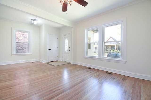 foyer featuring light wood-type flooring, ceiling fan, and ornamental molding