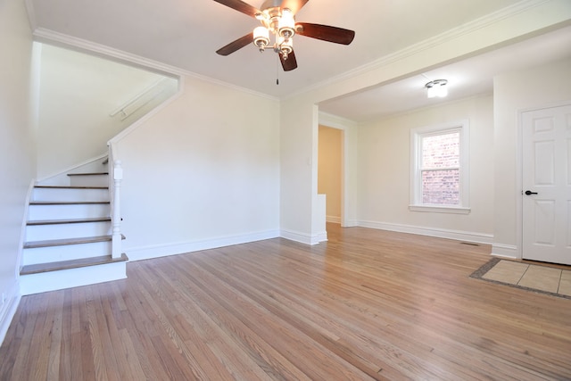 unfurnished living room with ceiling fan, crown molding, and light hardwood / wood-style flooring