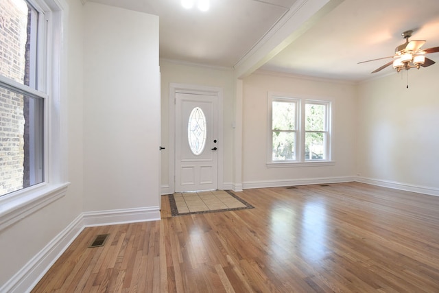 entryway featuring ceiling fan, crown molding, and light hardwood / wood-style flooring