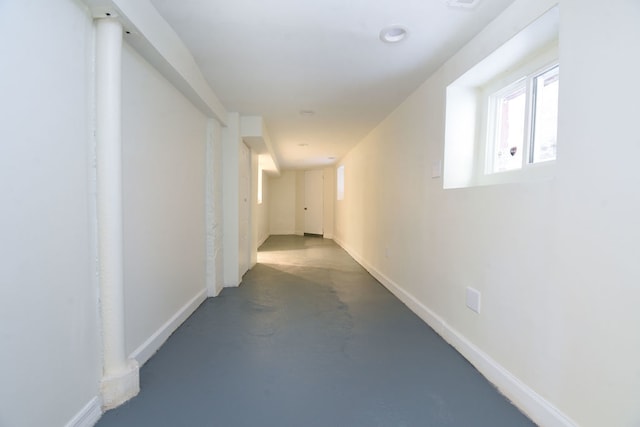 hall featuring concrete floors