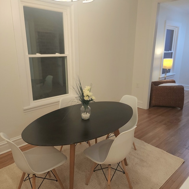 dining area with wood-type flooring