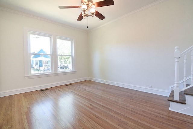 unfurnished room with crown molding, ceiling fan, and wood-type flooring