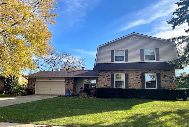 view of front property featuring a front yard and a garage