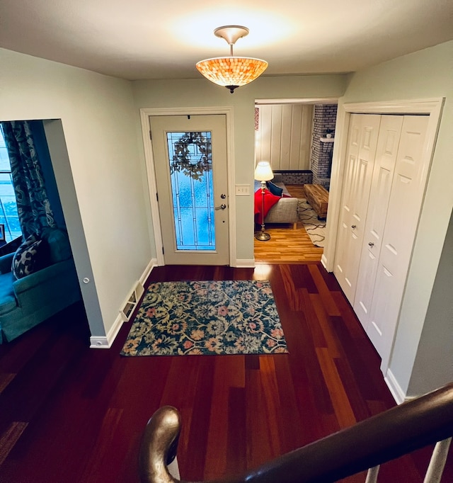 entrance foyer featuring dark wood-type flooring