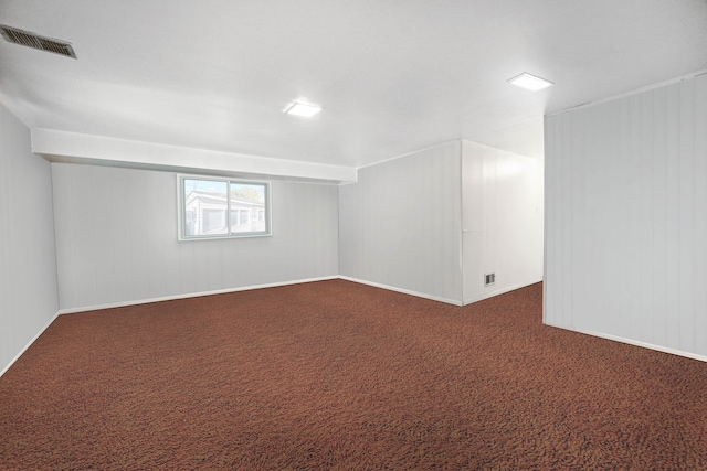 basement with dark carpet