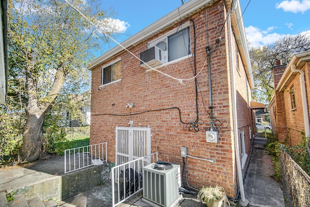 8916 S Eggleston Ave, Chicago, IL 60620 - back of house featuring central AC unit and brick siding