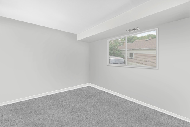 unfurnished room featuring carpet