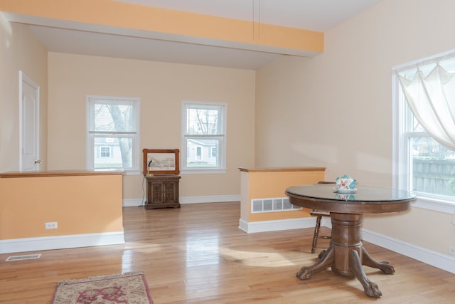 dining space featuring light wood-type flooring