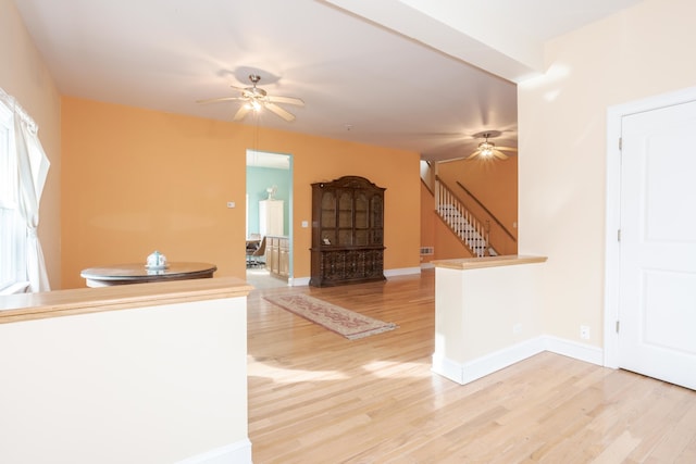 interior space with hardwood / wood-style flooring and ceiling fan