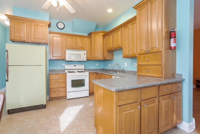 kitchen featuring kitchen peninsula, ceiling fan, white appliances, and sink