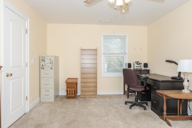 office space with ceiling fan and light carpet