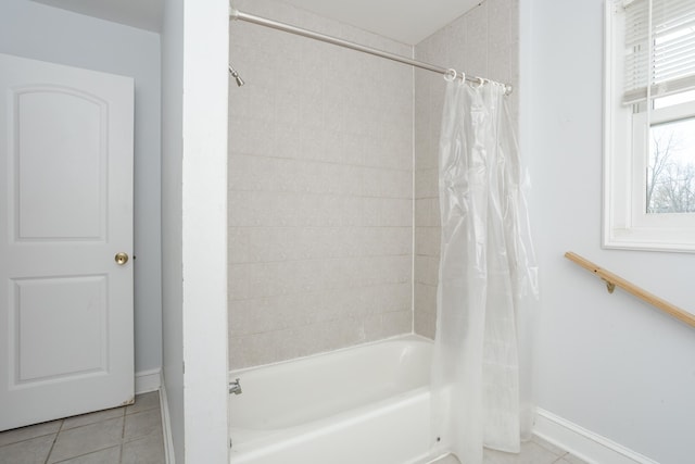 bathroom with tile patterned floors and shower / bath combo with shower curtain