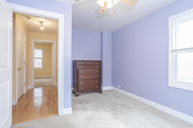 unfurnished bedroom featuring ceiling fan and light hardwood / wood-style floors