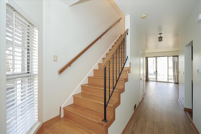 stairs with wood-type flooring