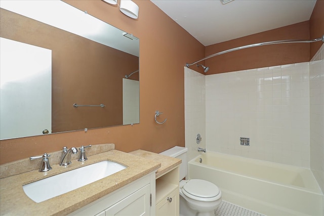 full bathroom featuring toilet, washtub / shower combination, vanity, and tile patterned floors