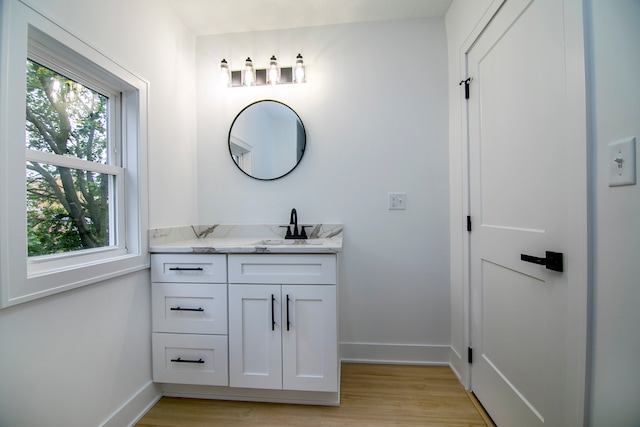 bathroom with vanity and hardwood / wood-style floors