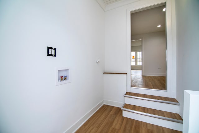 laundry room featuring wood-type flooring and hookup for a washing machine