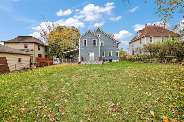 back of property featuring a lawn