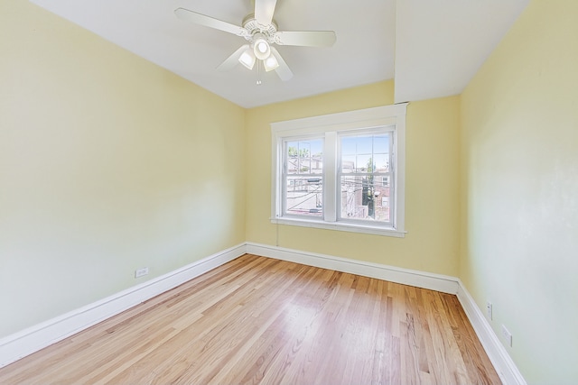 unfurnished room with ceiling fan and light hardwood / wood-style flooring