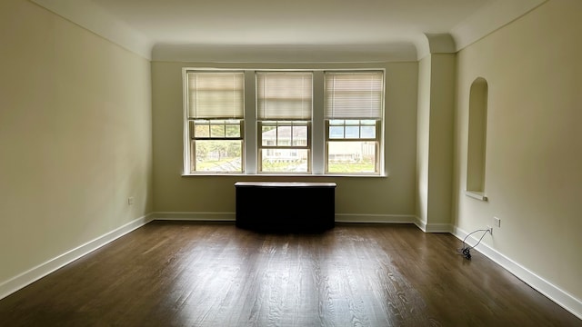 empty room with dark hardwood / wood-style floors