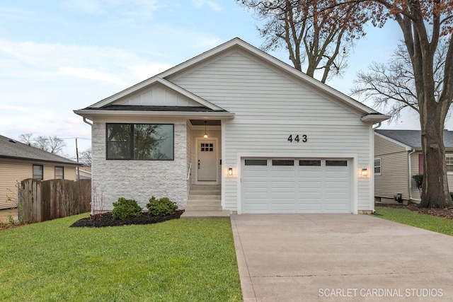 view of front of home with a garage and a front lawn