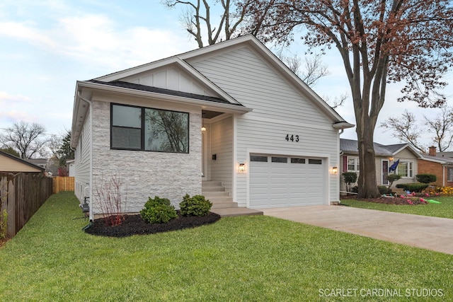 view of front of home featuring a front yard and a garage