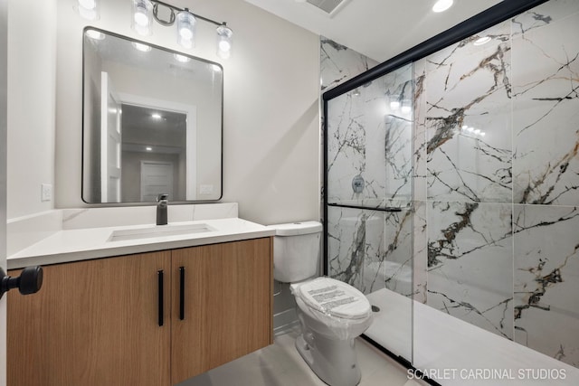 bathroom featuring vanity, an enclosed shower, and toilet