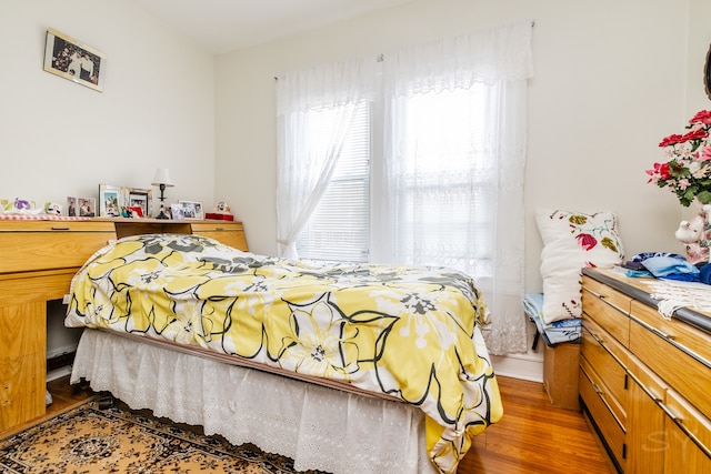 bedroom featuring wood-type flooring