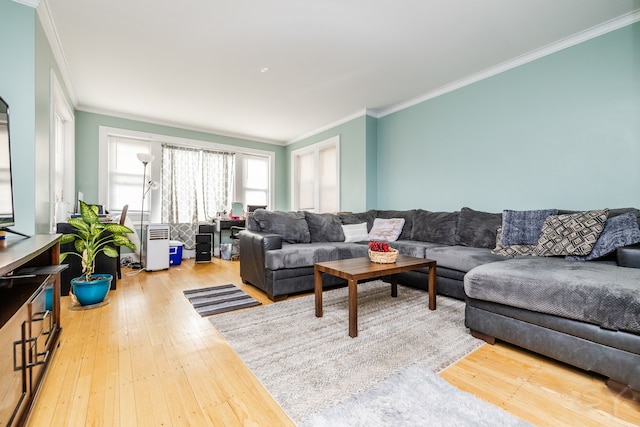 living room with ornamental molding and hardwood / wood-style floors