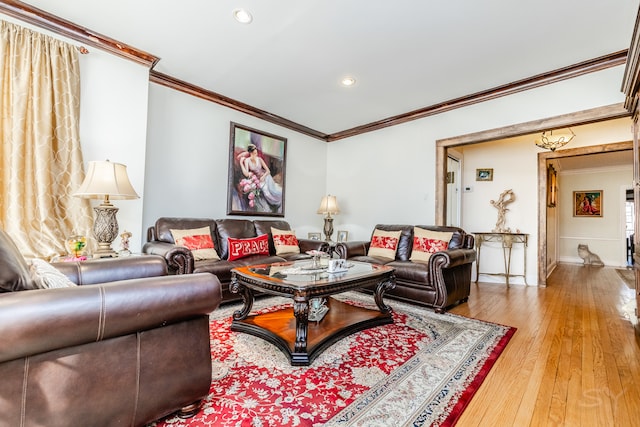 living room featuring crown molding and wood-type flooring