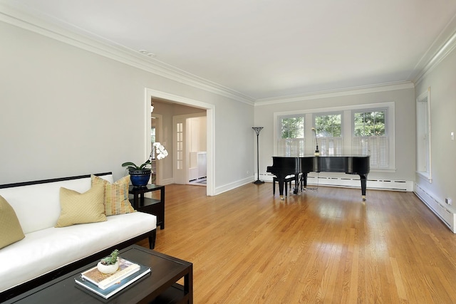 living room featuring ornamental molding, baseboards, a baseboard heating unit, and light wood finished floors