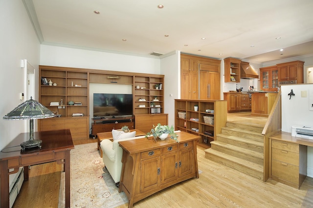 living area with visible vents, light wood-style flooring, baseboard heating, crown molding, and recessed lighting