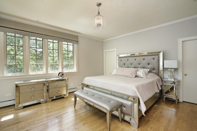 bedroom featuring ornamental molding, light wood finished floors, a baseboard radiator, and an inviting chandelier