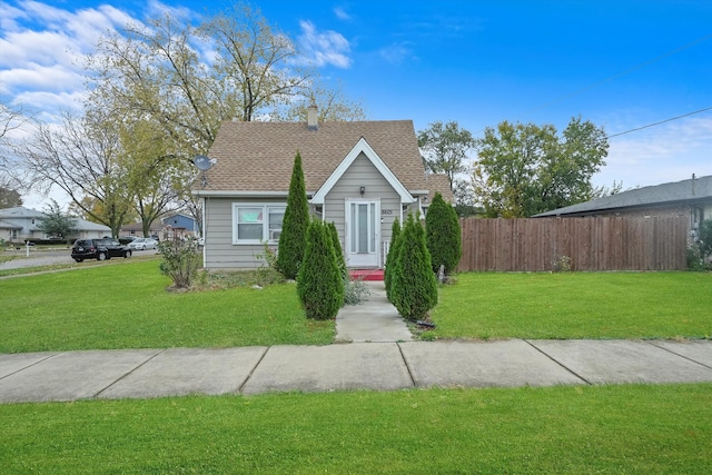 bungalow-style home featuring a front lawn